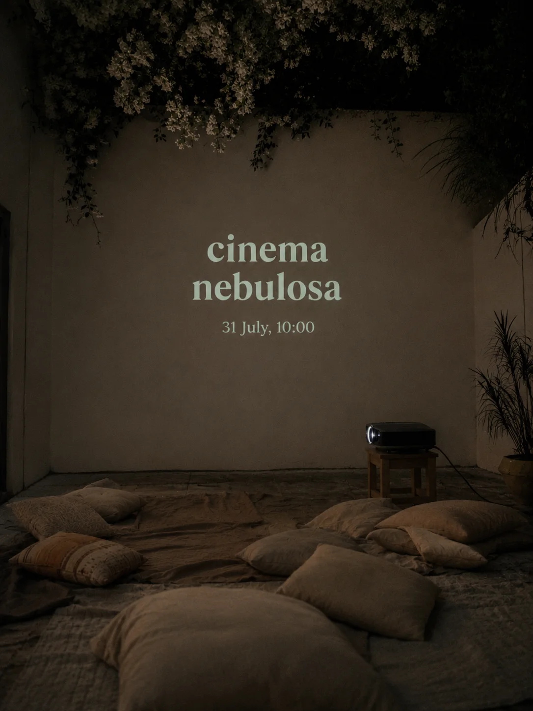 Cinema Nebulosa. 31 July, 10:00. An intimate patio cinema with cushions and a projected title.